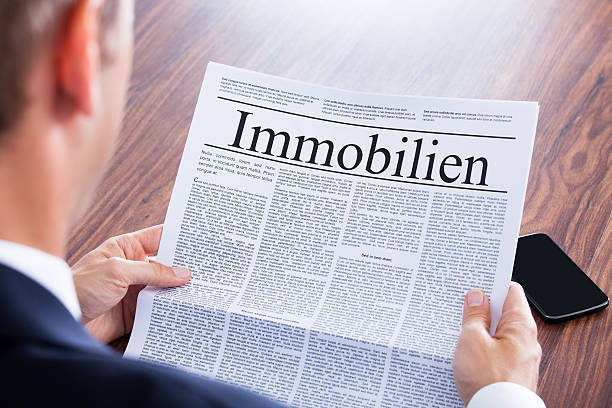 istock Businessman reading a newspaper 463694549