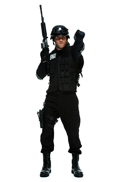 istock Front view of swat standing with rifle and pointing 463700987