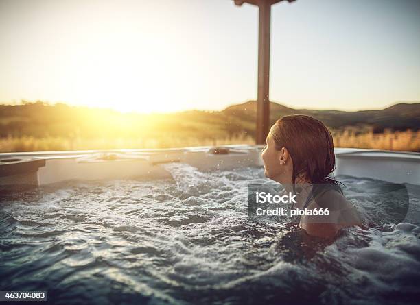 Woman In Whirlpool Hot Tub Stock Photo - Download Image Now - Hot Tub, Outdoors, Relaxation
