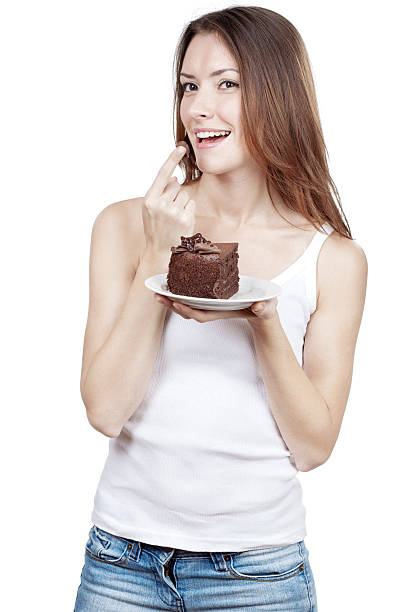 istock Beautiful young woman eating chocolate cake 463722975