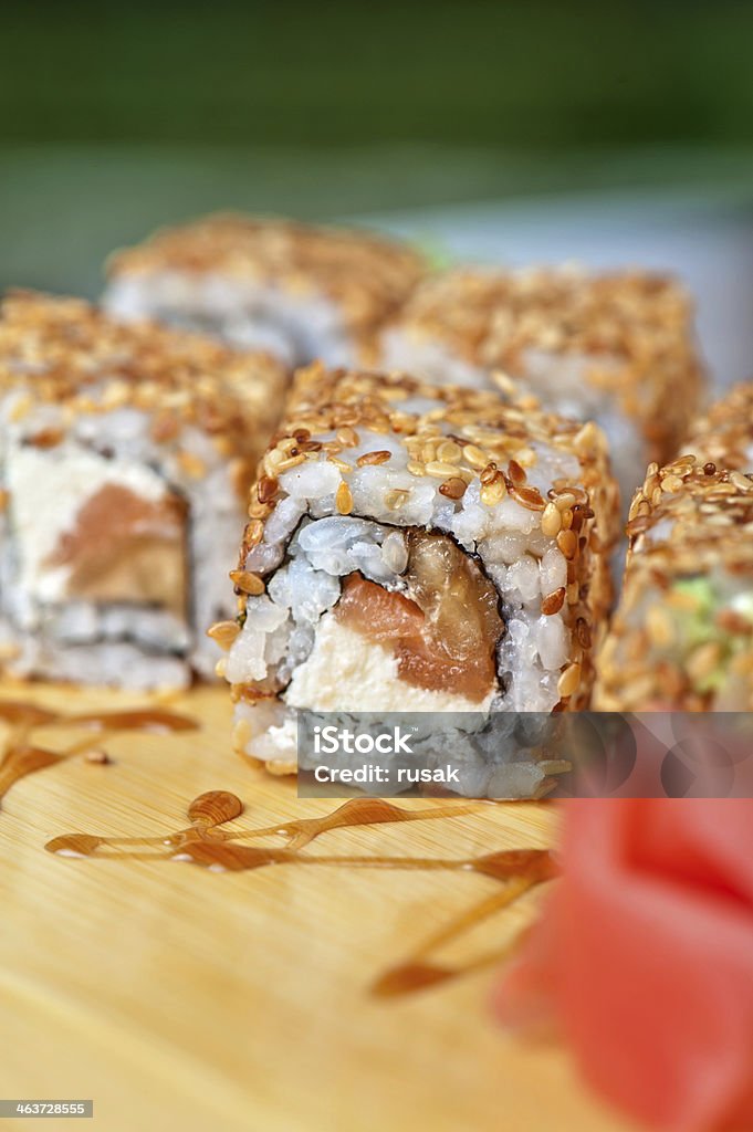 sesame sushi rolls Japanese cuisine - sesame sushi rolls with syrup Appetizer Stock Photo