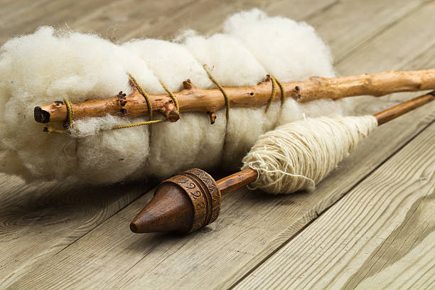 Detailed Vision Of A Spindle With Hand Spun Organic Sheep Wool On