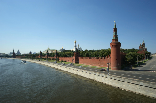 View of the Moscow Kremlin and Kremlin embankment from the Moskva River at summer day. Grand Kremlin palace. Church Of the Kremlin. Popular tourist attraction. Moscow, Russia - August 28, 2023