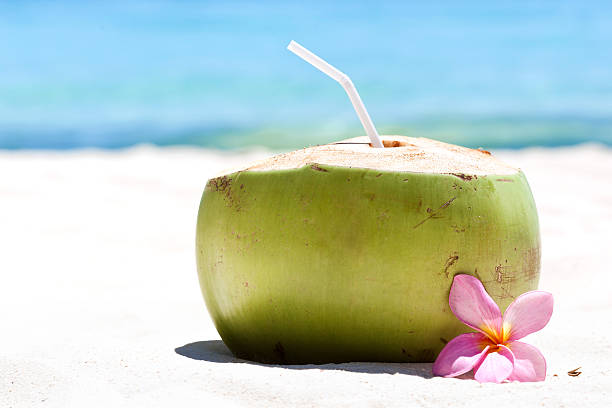 istock Tropical fresh cocktail on white beach 463741085