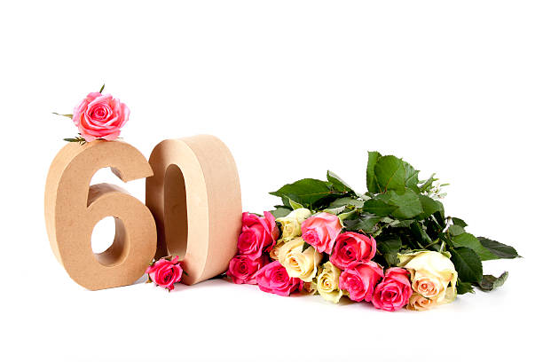 Age in numbers on a bed of roses stock photo