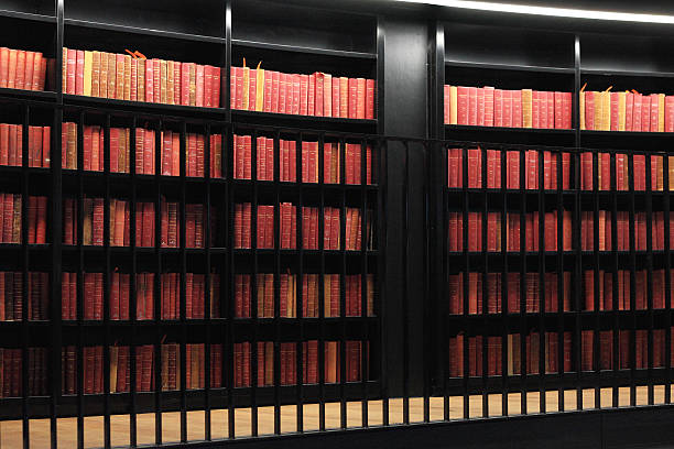Bookcases filled with old books in a modern library