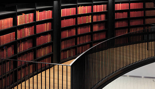 Old Books In A Modern Library A look at the old books in a modern library. law library stock pictures, royalty-free photos & images