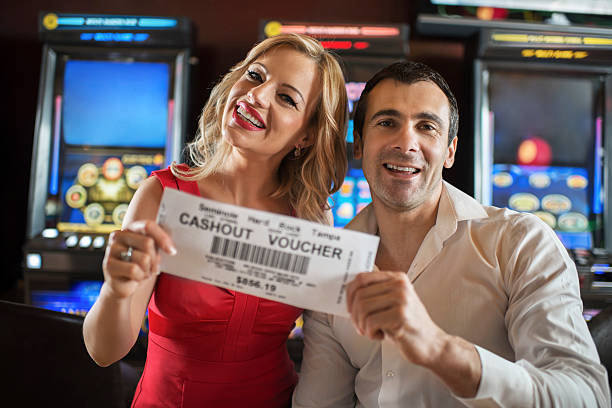 istock Happy couple holding a coupon. 463750359