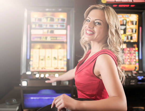 Woman gambling on slot machines.
