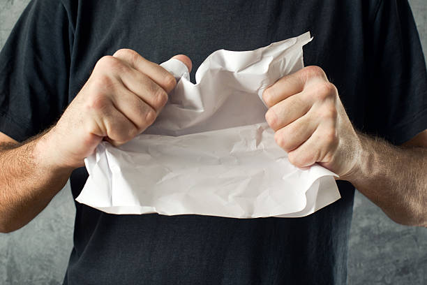 istock Man tearing contract paper 463750795
