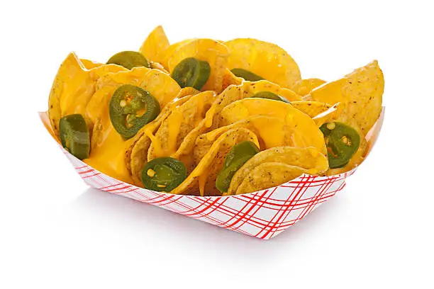 Nachos with jalapenos in a standard restaurant paper tray.