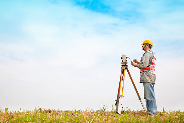 istock A surveyor taking measurements outdoors 463758761