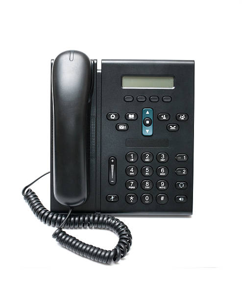istock Black desk phone on a white background 463763911