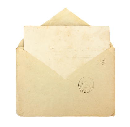 Old envelope with blank card on a white background