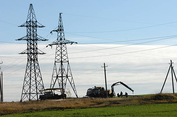 istock Electric post in a field and blue sky 463781037
