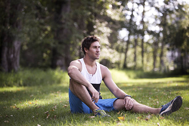 istock Young Male Athlete Resting Outside 463782473
