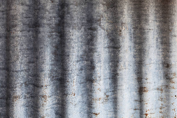 istock Rusty old corrugated iron fence close up 463785323
