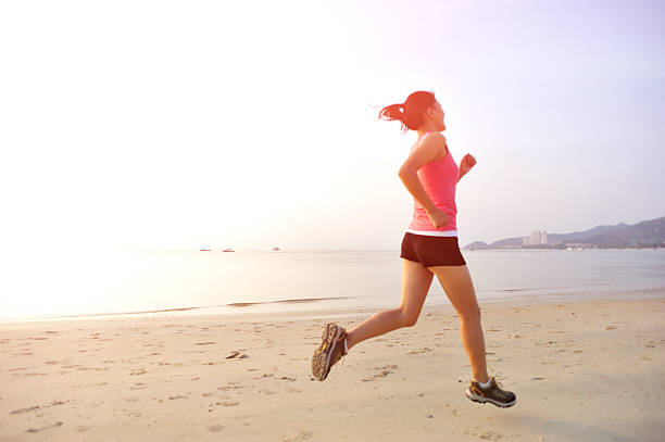 istock woman running on beach 463785413