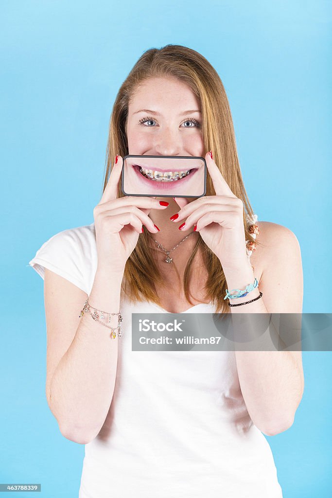 Smiling Girl Holding Smartphone Dental Braces Stock Photo