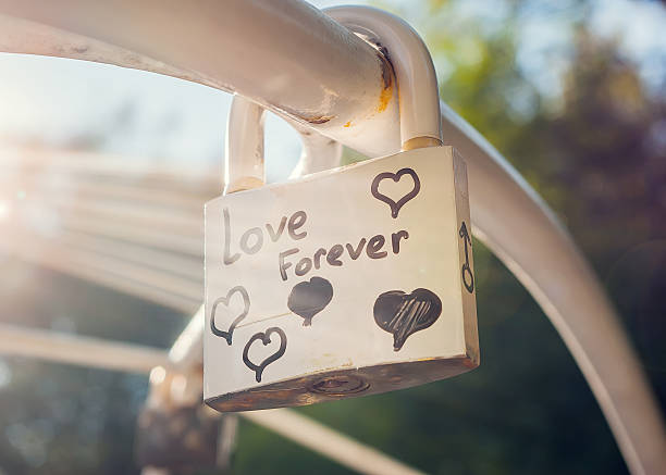 Love forever padlock with lens flare stock photo