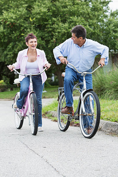 istock Mature couple riding bicycles 463803033