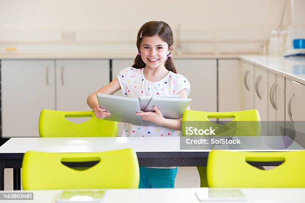 Young Student In The Classroom Stock Photo - Download Image Now - 8-9 Years, Adult, Assistance