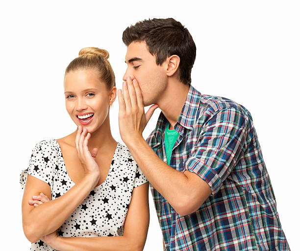 istock Man Whispering Into Woman's Ear - Isolated 463803547