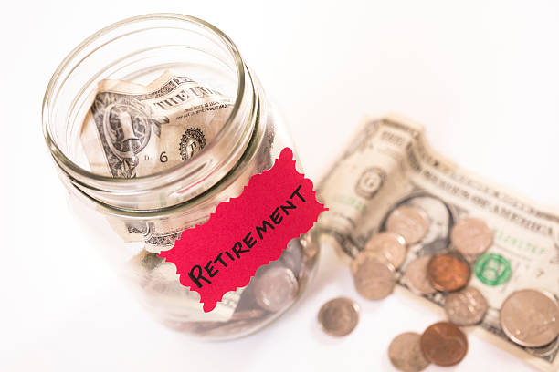 istock Concept:  Money Jar with U.S. currency.  Saving for retirement. 463803601