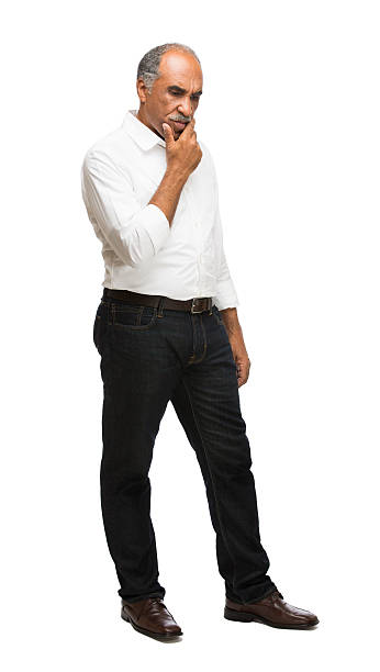 Worried latin male A mature latin male in casual clothes looking worried. Isolated on a white background. worried man standing stock pictures, royalty-free photos & images