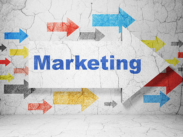 istock Advertising concept: arrow with Marketing on grunge wall background 463812143