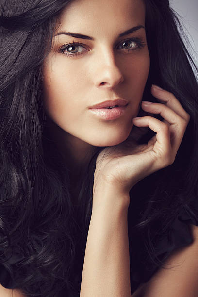 istock Beautiful woman on dark background 463814097