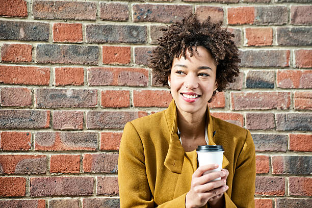 Young woman with takeway drink