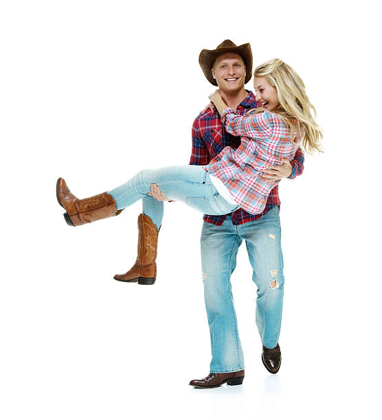 istock Cheerful cowboy couple country dancing 463814885