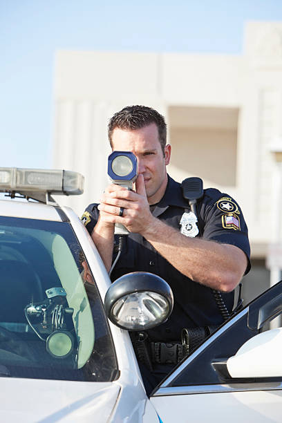 istock Police officer with radar gun 463815003