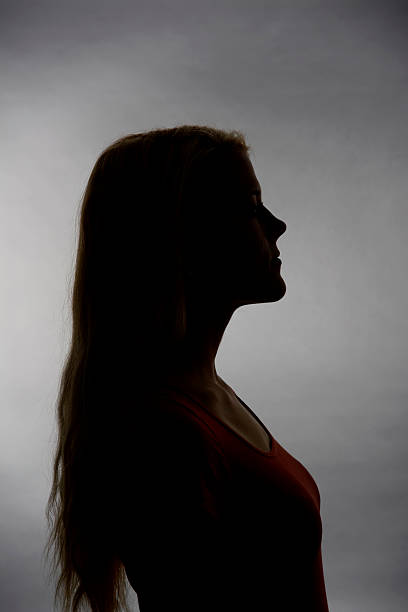 istock silhouette of young woman 463827601