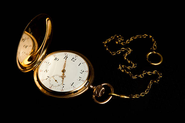 istock Gold pocket watch on black cloth 463837843