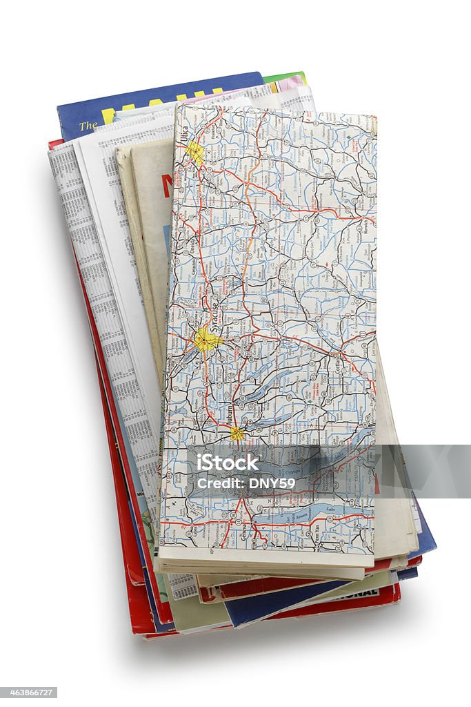 Stack of Road Maps A stack of road maps isolated on white.  Clipping path included. Map Stock Photo
