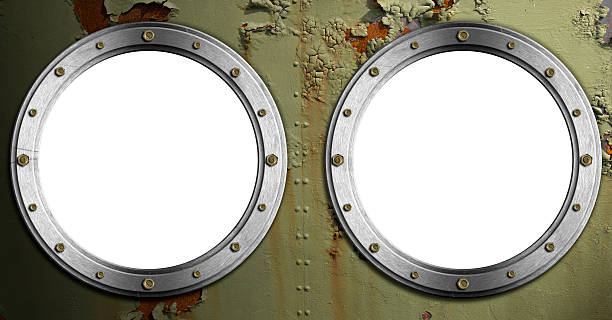 istock Two Metal Portholes on Green Background 463871929