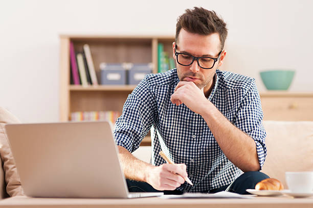 istock Portrait of focus man working at home 463874293