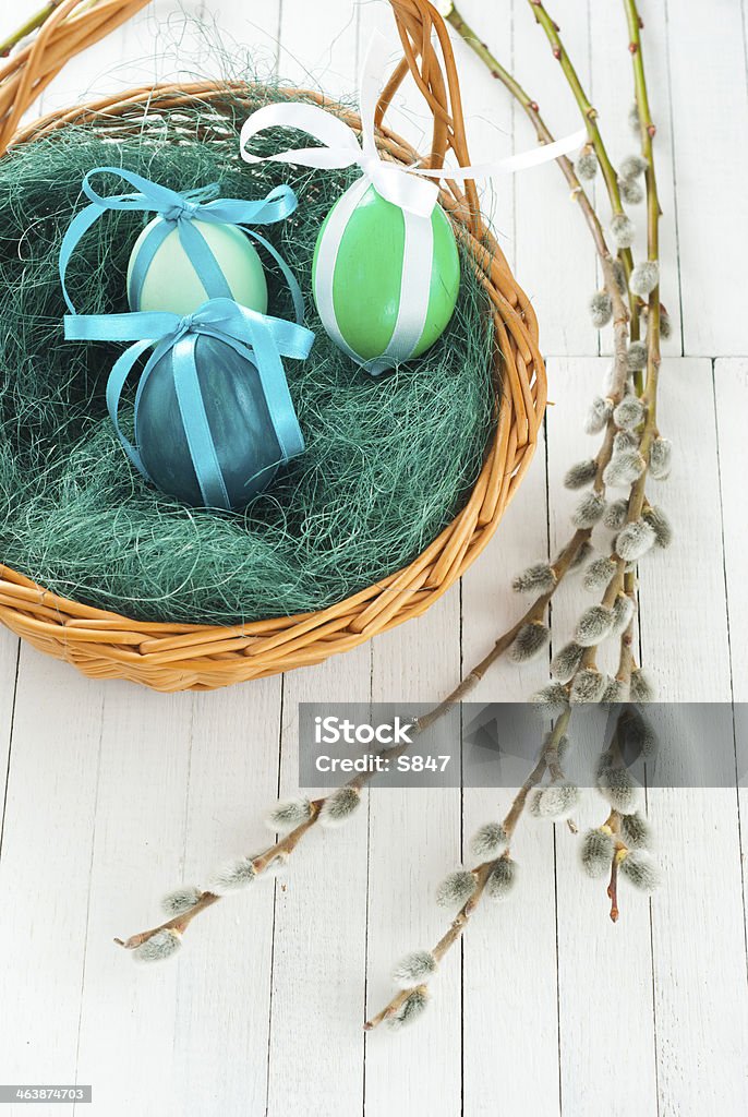 Easter basket easter painted eggs with pussy willows Basket Stock Photo