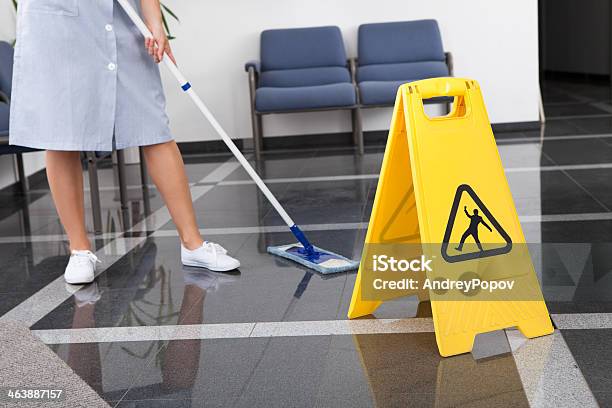 Maid Cleaning The Floor Stock Photo - Download Image Now - Cleaner, Dusting, Expertise
