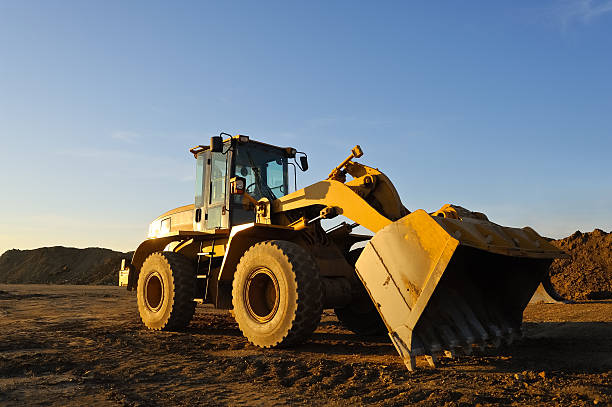 istock wheel loaders and shovel on a construction site 463893115