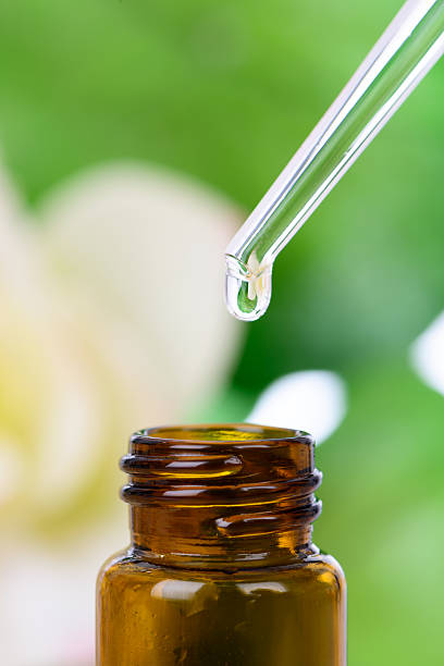 istock Essential Oil With Hibiscus Flowers 463910235