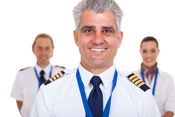 istock senior captain standing in front of airline crew 463946171