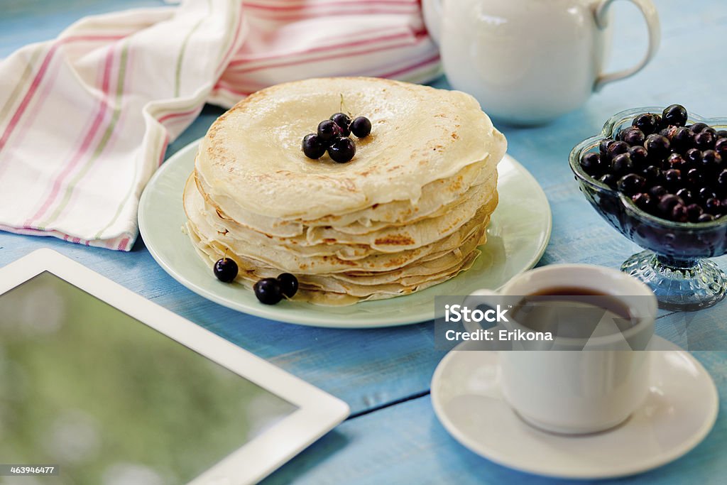 Digital tablet and pancakes Digital tablet and pancakes on table Breakfast Stock Photo