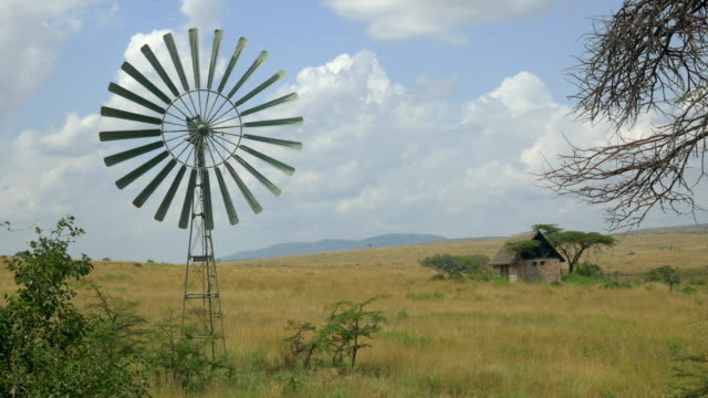 Old windmill spinning in Africa