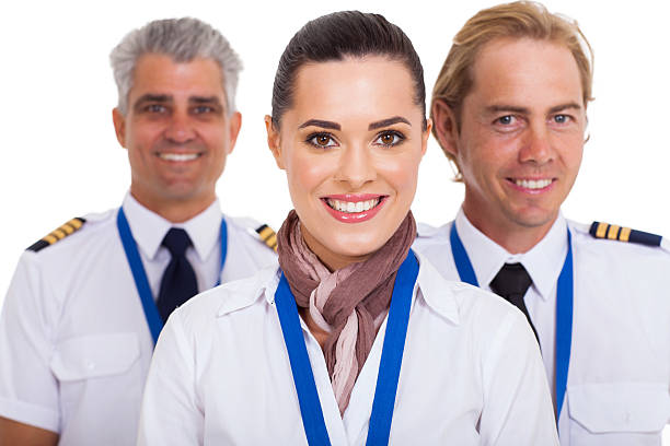 istock flight attendant standing in front of pilots 464065839
