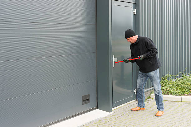 istock burglar with a crowbar 464066425