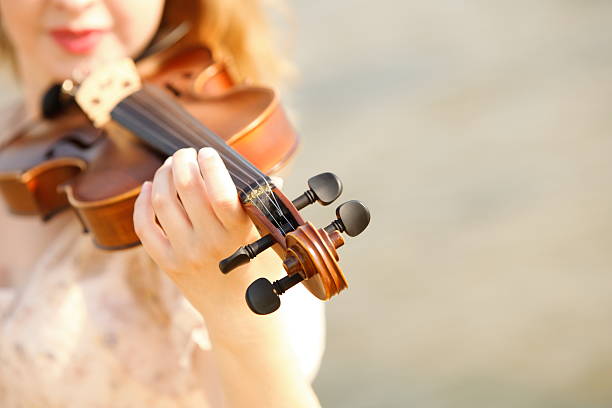 istock Female hand with a violin outdoor 464067991