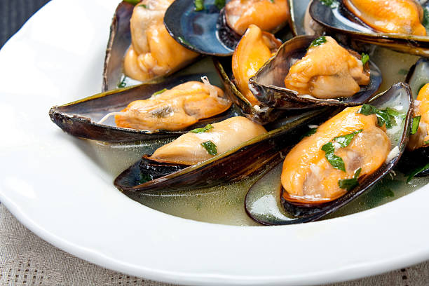 istock Mussels with white wine and parsley sauce 464077623